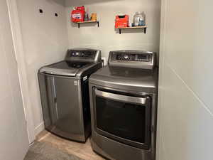 Laundry room featuring independent washer and dryer