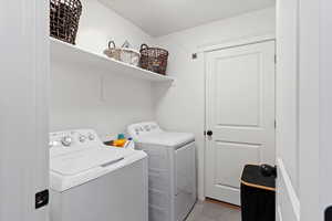 Washroom with washing machine and dryer