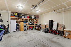 Garage with freestanding refrigerator