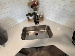 Kitchen view of light stone countertops