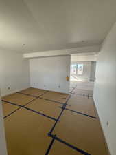 Unfurnished room featuring a textured ceiling