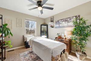 Bedroom with carpet flooring and a ceiling fan