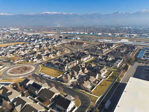 Aerial overview of property's location with nearby suburban area and a mountain backdrop