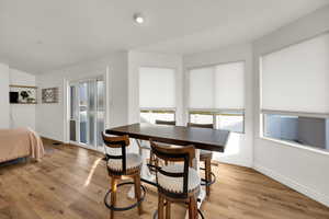 Dining room featuring baseboards and light wood-style floors