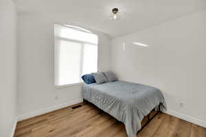 Bedroom featuring light wood-type flooring