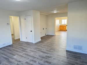 Empty room featuring wood finished floors