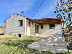 View of front of house featuring a patio area and a front lawn