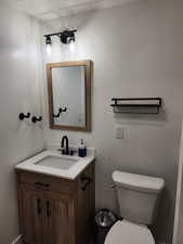 Bathroom featuring vanity and toilet