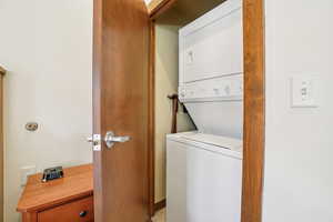 Laundry area with stacked washer / dryer