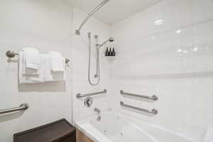 Full bathroom with a combined bath / shower with jetted tub