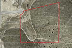 Aerial map of property and surrounding area featuring property parcel outlined