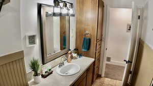 Bathroom with vanity and light tile patterned flooring