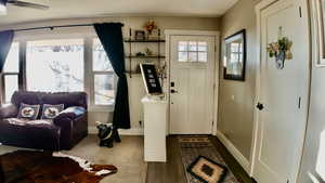 Entrance foyer featuring baseboards and LVP finished floors