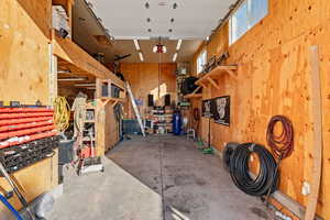 Garage featuring wooden walls