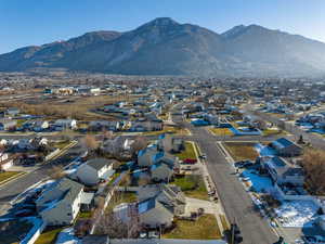 Aerial view of residential area featuring a mountainous background