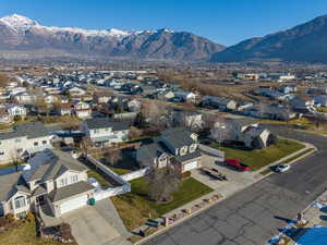 Aerial view of residential area featuring a mountain backdrop