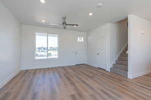 Entrance foyer with stairs, light wood finished floors, recessed lighting, and a ceiling fan