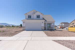 View of front of home featuring stone siding, concrete driveway, an attached garage, a porch, and roof with shingles