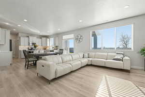 Living room featuring recessed lighting and light wood-style floors