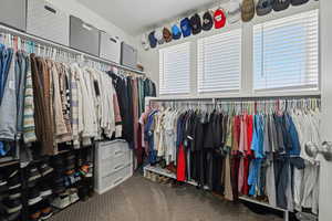 Spacious closet with carpet