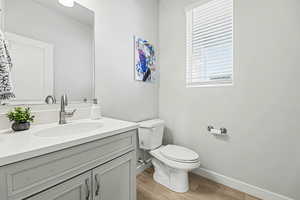 Bathroom featuring vanity and light wood-type flooring