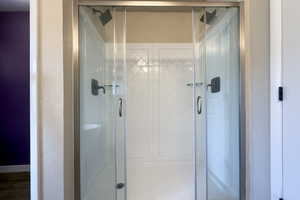 Full bathroom featuring dual head shower