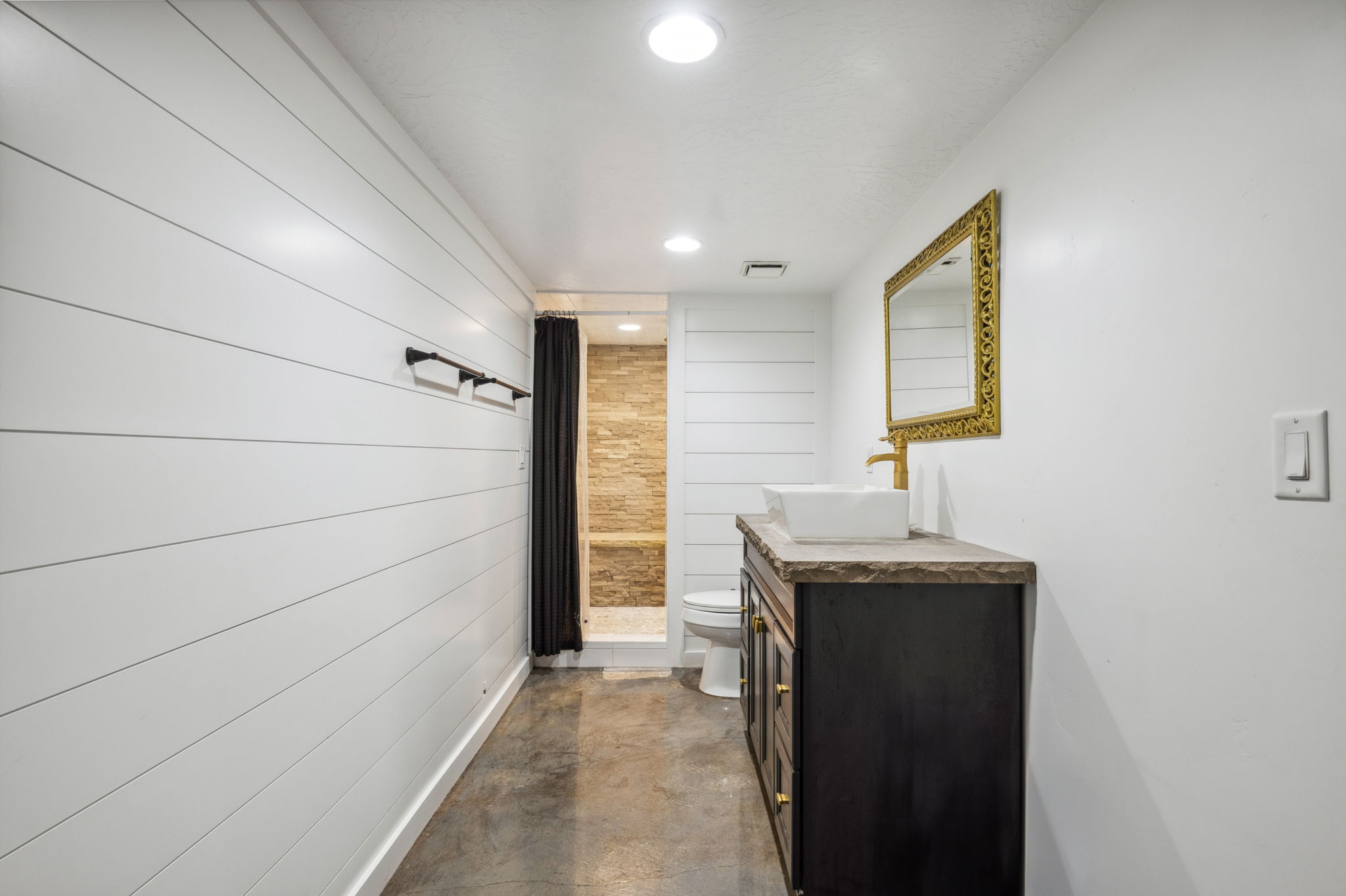 Full bathroom with vanity, a shower with curtain, concrete floors, and recessed lighting