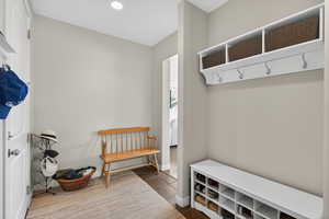 Mudroom with baseboards and recessed lighting