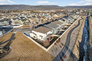 Aerial view of residential area featuring a mountain backdrop