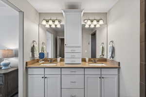 Primary Bathroom featuring double vanity