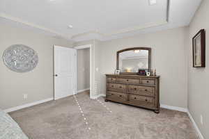 Primary Bedroom featuring a textured ceiling and light carpet