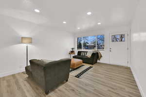 Living room featuring recessed lighting and light wood-style flooring