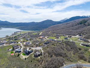 Aerial view of residential area featuring a water and mountain view