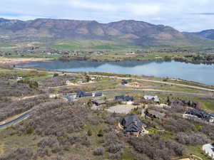Aerial view of residential area featuring a water and mountain view