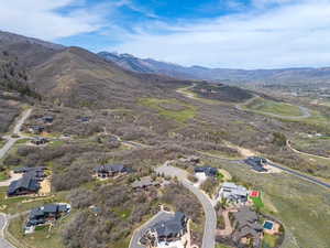 Aerial perspective of suburban area featuring a mountainous background