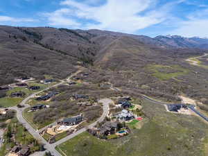 Aerial view of residential area featuring a mountainous background