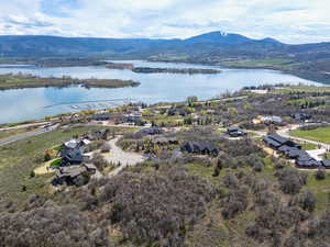 Aerial perspective of suburban area featuring a water and mountain view