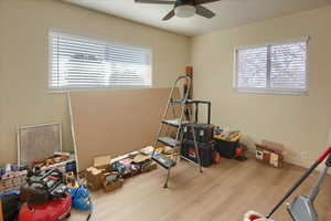 Playroom featuring light wood-style flooring and a ceiling fan