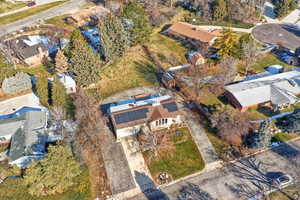 Aerial overview of property's location featuring nearby suburban area