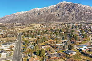 View of mountain backdrop featuring nearby suburban area