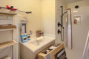 Bathroom featuring a walk in shower