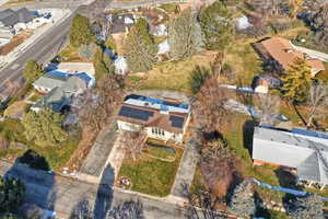 Aerial view of property's location with nearby suburban area