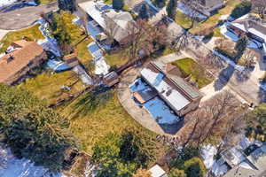 Aerial overview of property's location featuring nearby suburban area