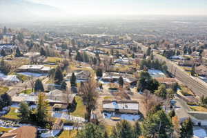 Aerial view of property's location with nearby suburban area