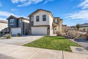 View of front facade featuring stone siding, a garage, concrete driveway, a front lawn, and board and batten siding