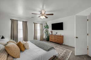 Bedroom with carpet flooring and a ceiling fan