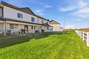 Back of property featuring board and batten siding and roof with shingles