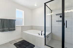 Full bathroom with a shower stall, a bath, light tile floors, and recessed lighting