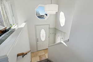 Entrance foyer with a vaulted ceiling