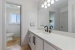 Bathroom with vanity and toilet